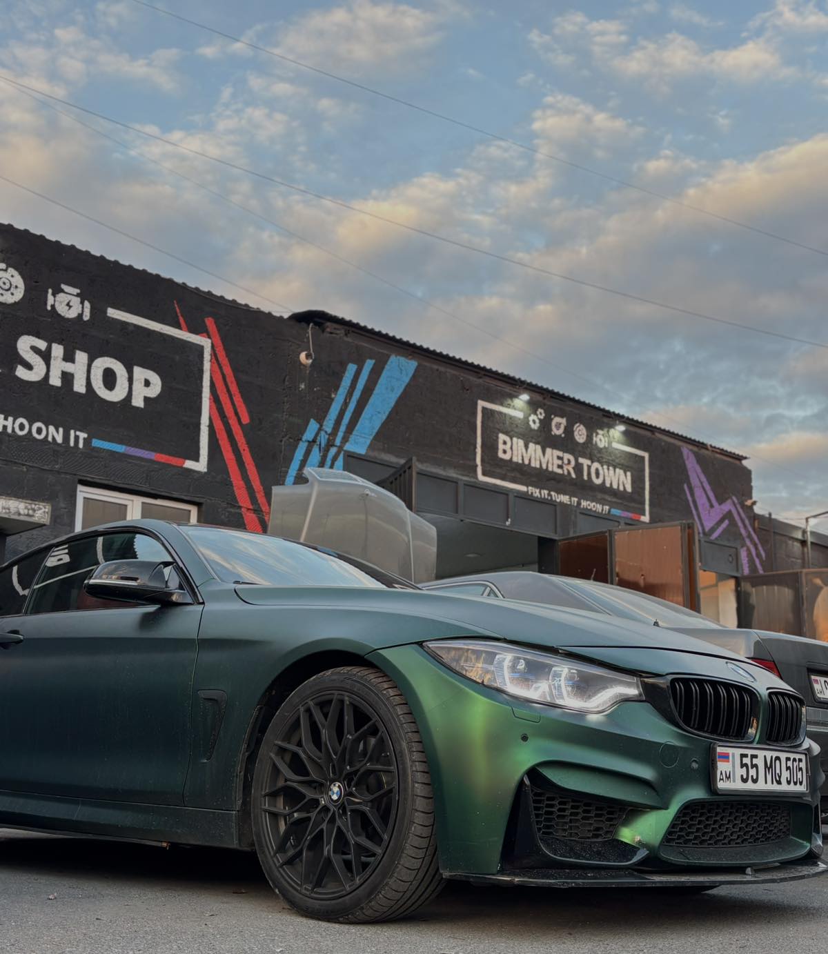 BMW in front of Bimmer Town building